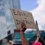 Person holding sign